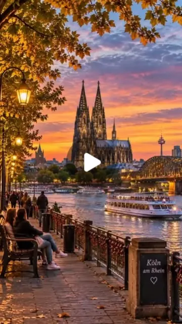 Cologne Cathedral and Hohenzollern Bridge at sunset from the Rhine promenade